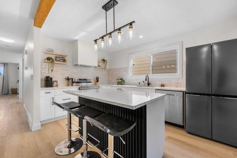 Photo of 966 Berkley Drive NW, Calgary, AB T3K 1A2 (MLS # A2264814) Photo of 966 Berkley Drive NW, Calgary, AB T3K 1A2 (MLS # A2264814)