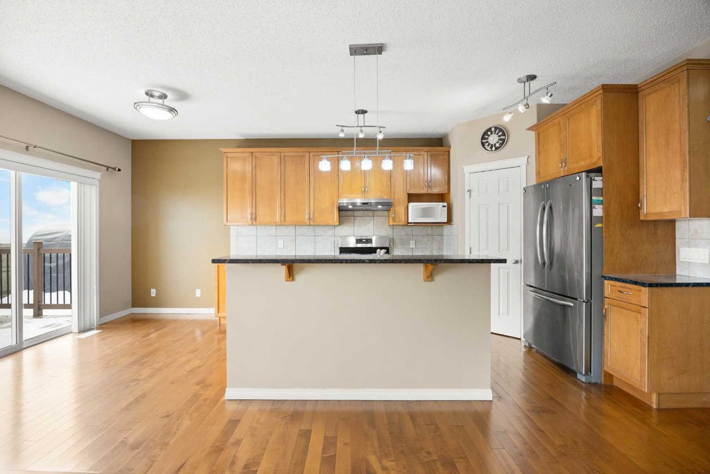 Photo of 65 Panora Way NW, Calgary, AB T3K 0R4 (MLS # A2347913)