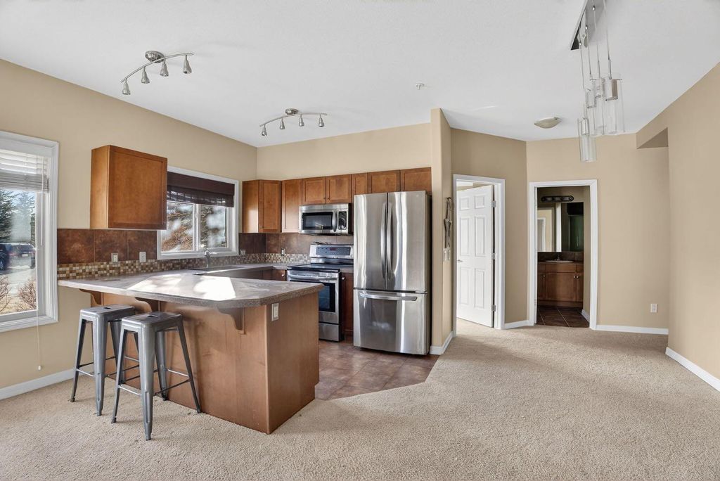 Photo of 92 Crystal Shores Road #4103, Okotoks, AB T1S 2N2 (MLS # A2286784)