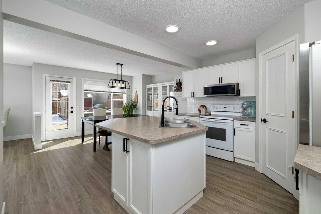 Photo of 316 Mt Brewster Circle SE, Calgary, AB T2Z 3J2 (MLS # A2296159)