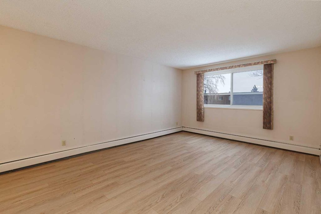 Photo of 6464 Travois Crescent NW #205, Calgary, AB T2K 3S9 (MLS # A2302757)