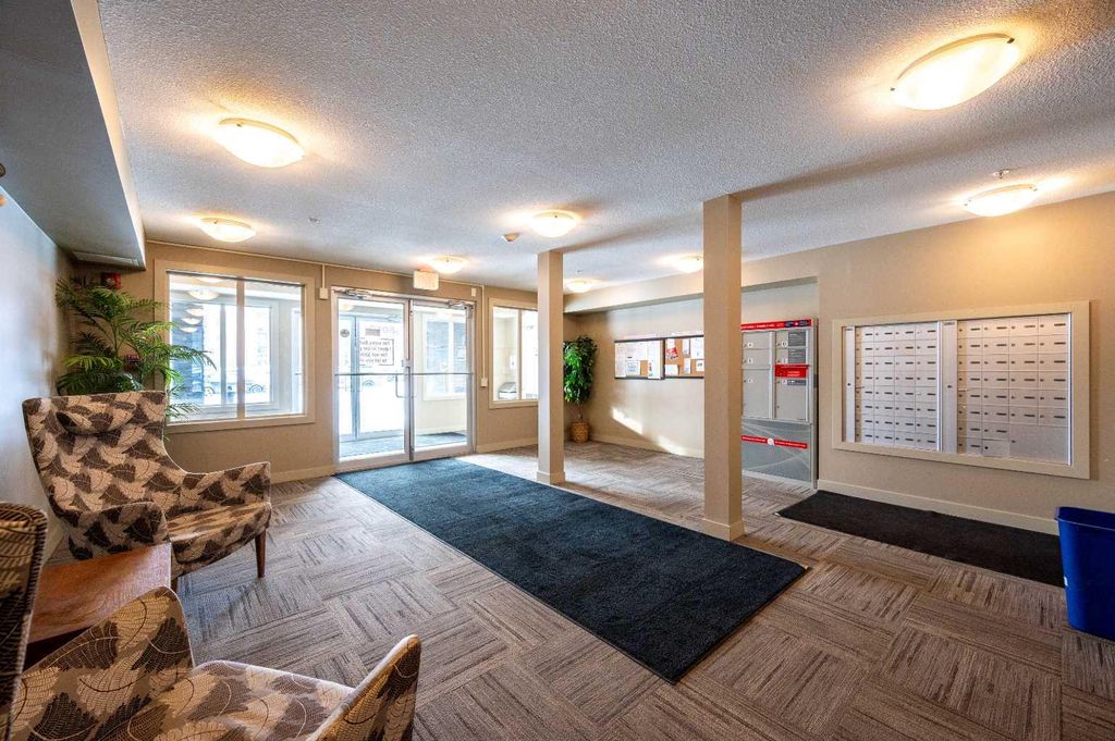 Photo of 403 Mackenzie Way SW #8206, Airdrie, AB T4B 3V7 (MLS # A2289815)