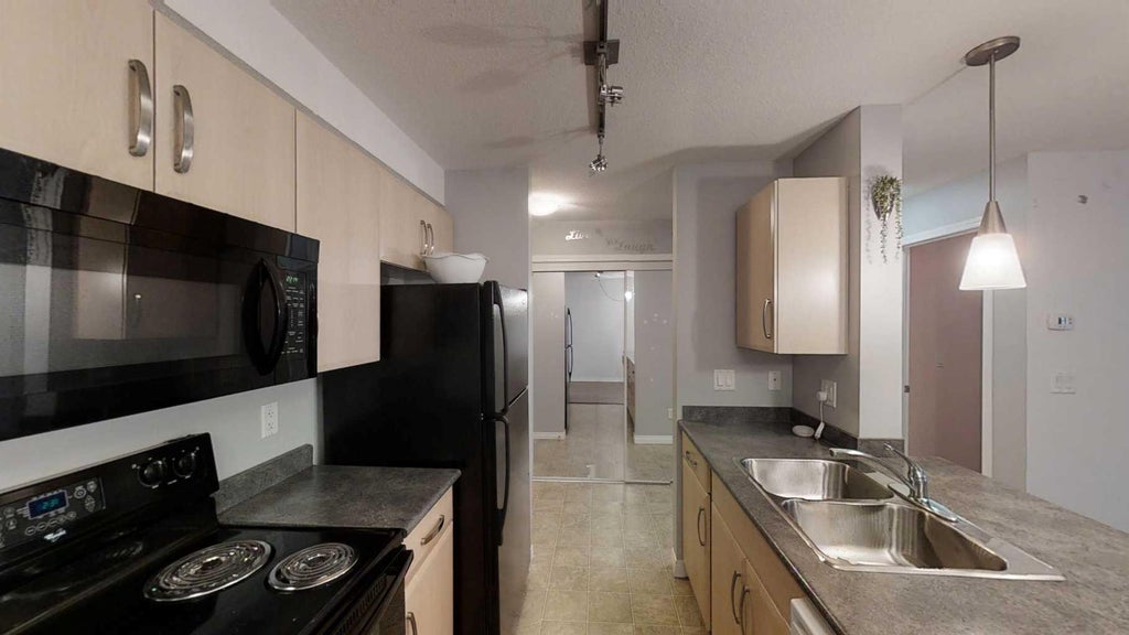 Photo of 9124 96 Avenue #112, Grande Prairie, AB T8X 0A1 (MLS # A2331515)