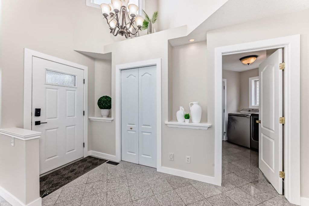 Photo of 311 Rocky Ridge Cove NW, Calgary, AB T3G 4K1 (MLS # A2300845)