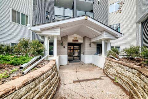 Photo of 10 Sierra Morena Mews SW #214, Calgary, AB T3H 3K5 (MLS # A2325662)