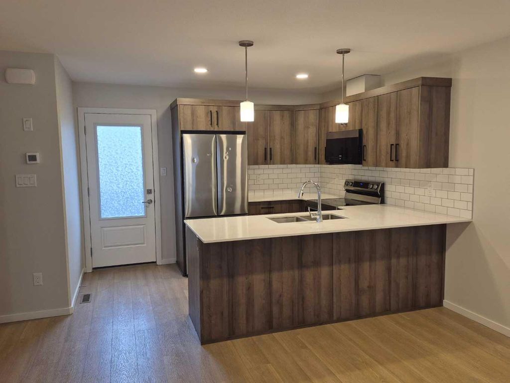 Photo of 594 Aquitania Boulevard W #3, Lethbridge, AB T1J 5X4 (MLS # A2317528)