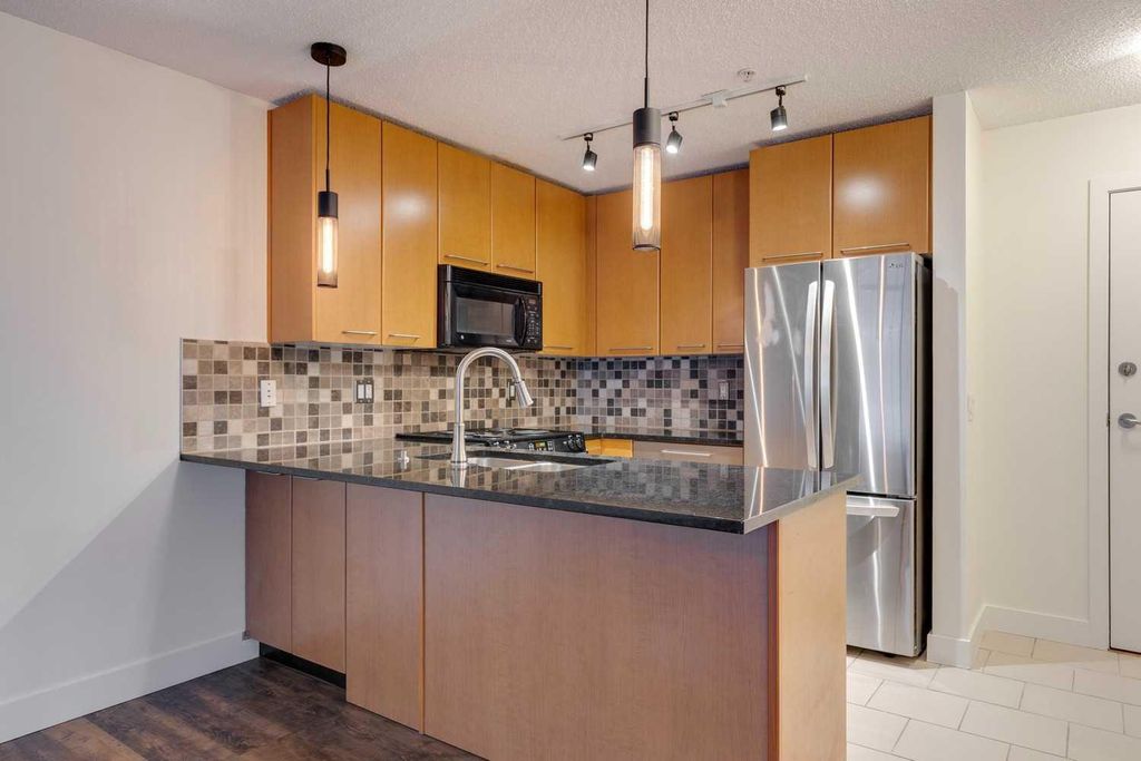 Photo of 35 Richard Court SW #106, Calgary, AB T3E 7N9 (MLS # A2275483)