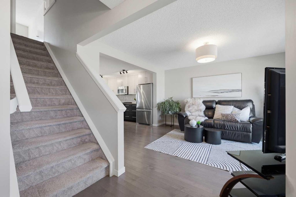 Photo of 17 Fireside Cove, Cochrane, AB T4C 0X3 (MLS # A2344401)