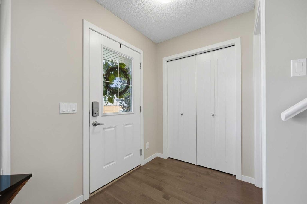 Photo of 17 Fireside Cove, Cochrane, AB T4C 0X3 (MLS # A2344401)