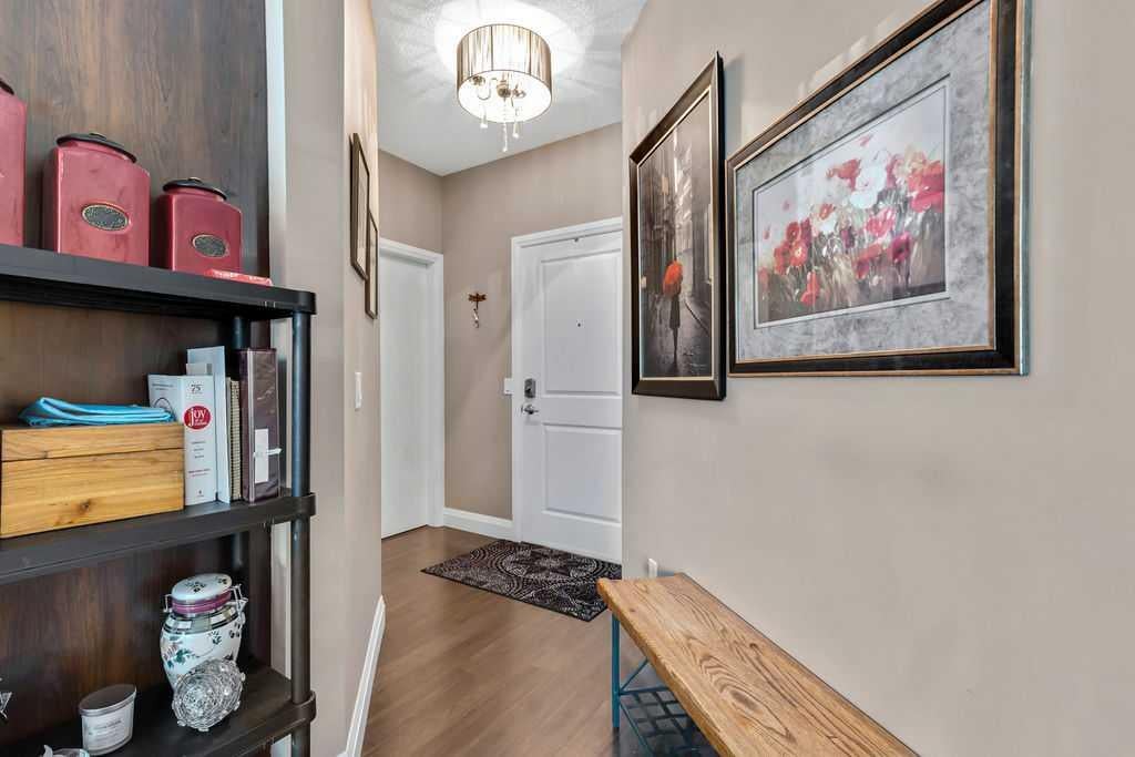 Photo of 15 Sunset Square #2110, Cochrane, AB T4C 0E7 (MLS # A2328598)