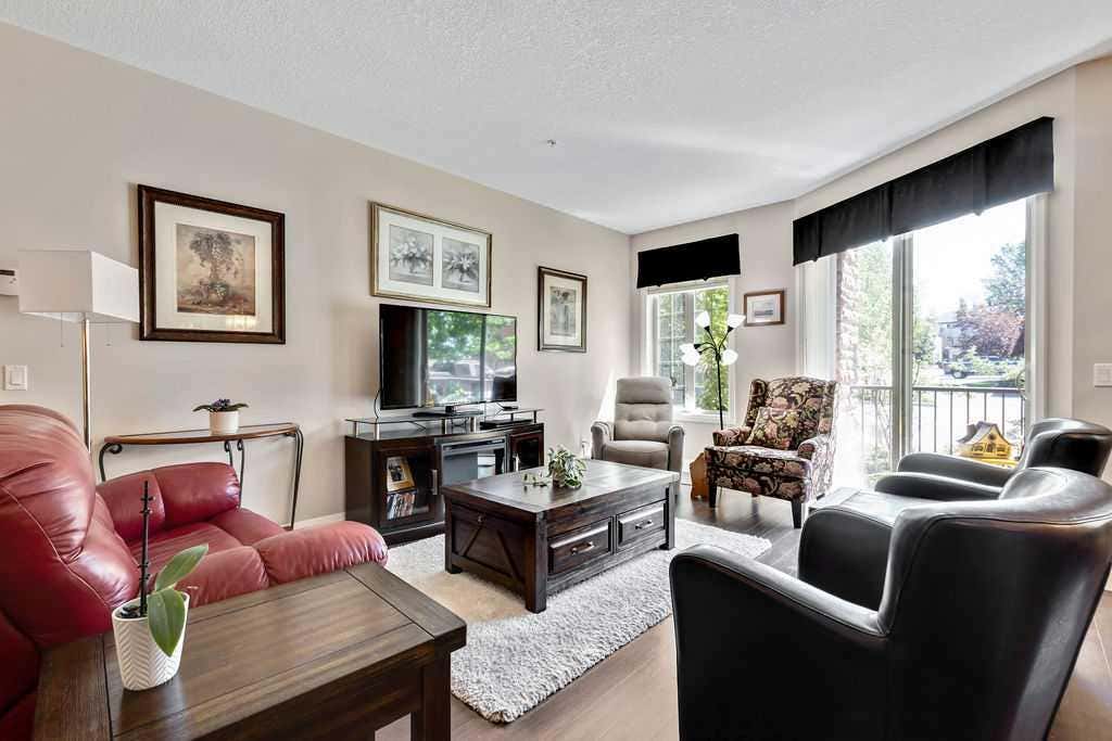 Photo of 15 Sunset Square #2110, Cochrane, AB T4C 0E7 (MLS # A2328598)