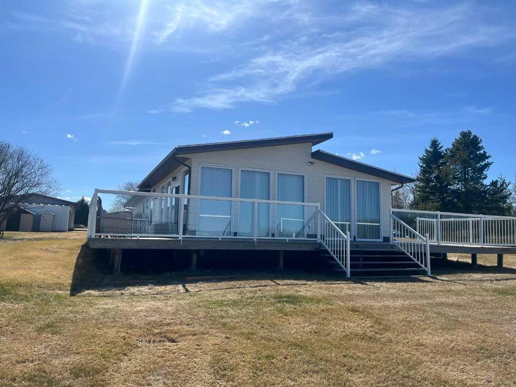 Photo of 303 Cumming Drive, Brightsand Lake, SK S0M 1J0 (MLS # A2309537)