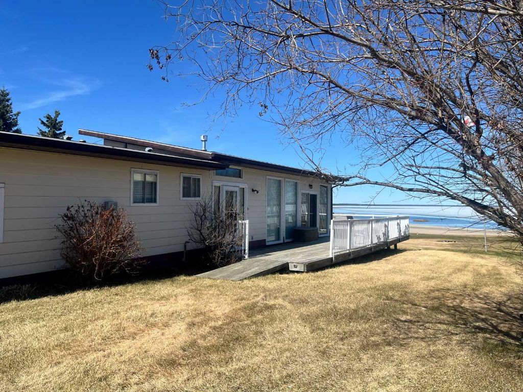 Photo of 303 Cumming Drive, Brightsand Lake, SK S0M 1J0 (MLS # A2309537)