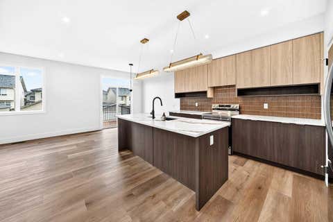 Photo of 226 Greystone Boulevard, Cochrane, AB T4C 3K3 (MLS # A2314990)