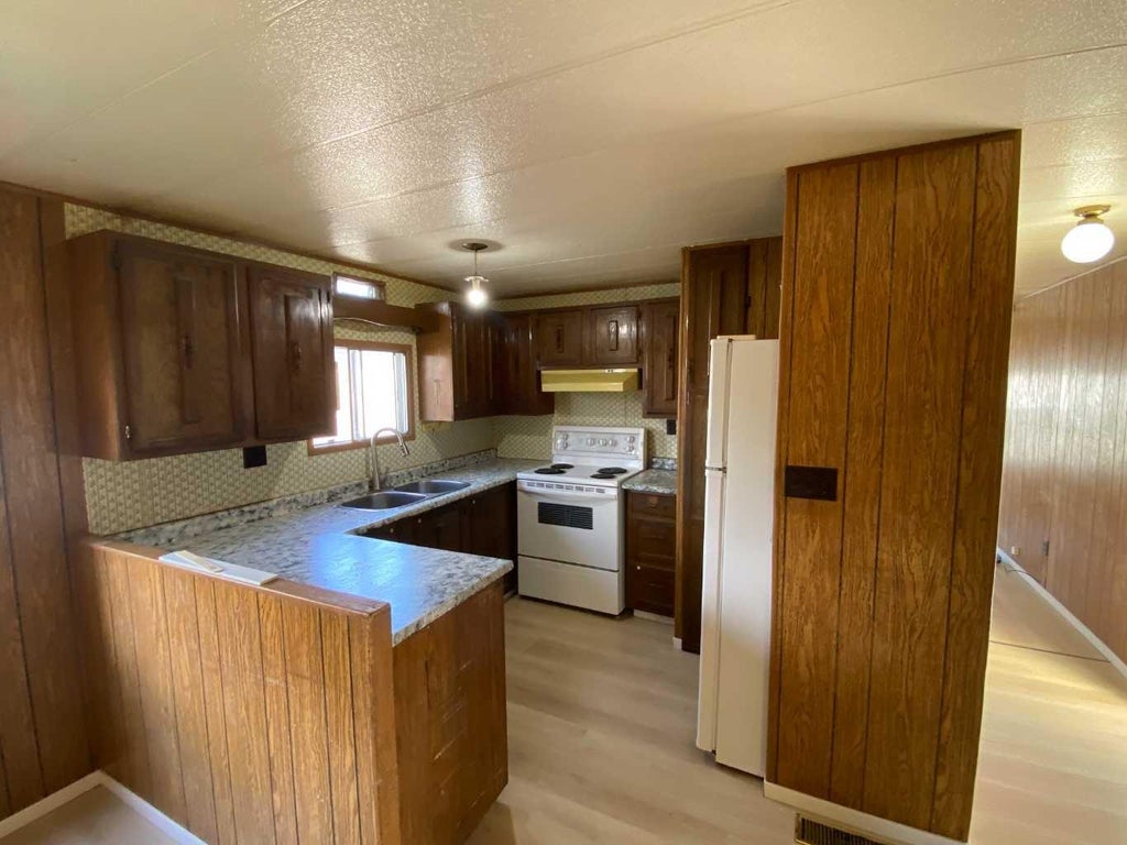 Photo of 27 LAKE STAFFORD Crescent E, Brooks, AB T1R 0P5 (MLS # A2348270)