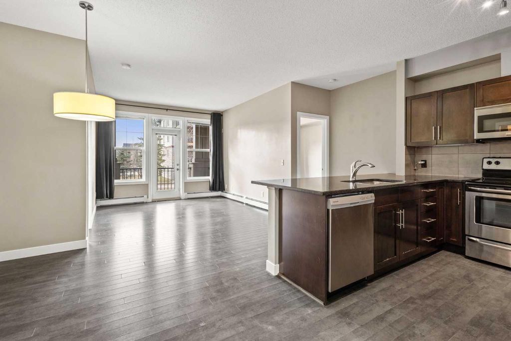 Photo of 48 Panatella Road NW #207, Calgary, AB T3K 0V4 (MLS # A2302195)