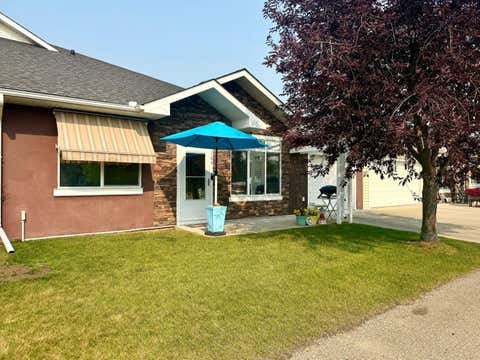 Photo of 104 Sunvale Crescent NE, High River, AB T1V 0E8 (MLS # A2331001)