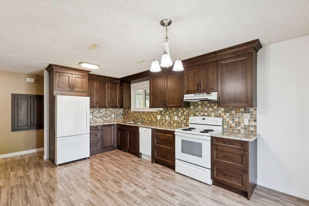 Photo of 918 38 Street SE, Calgary, AB T2A 1G2 (MLS # A2316163)