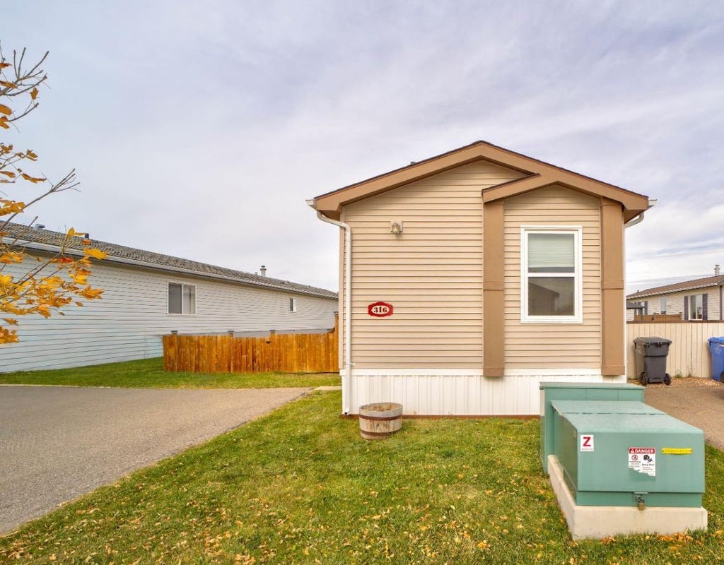 Photo of 316 Spurline Avenue, Coaldale, AB T1M 0B1 (MLS # A2350751)