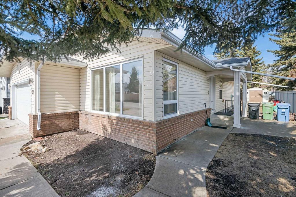 Photo of 51 Woodmont Road SW, Calgary, AB T2W 4L6 (MLS # A2324229)