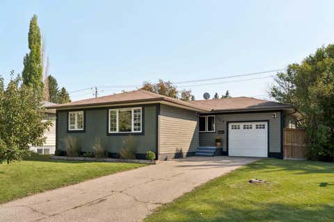Photo of 129 Springwood Drive SW, Calgary, AB T2W 0K8 (MLS # A2338602)