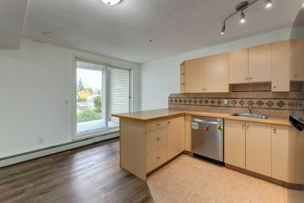 Photo of 1717 60 Street SE #119, Calgary, AB T2A 7Y7 (MLS # A2351076)