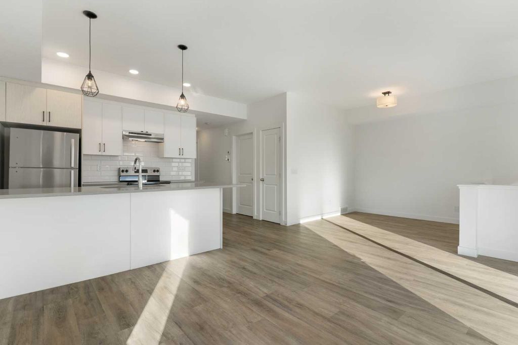 Photo of 24 Rivercrest Drive #602, Cochrane, AB T4C 2C5 (MLS # A2292589)