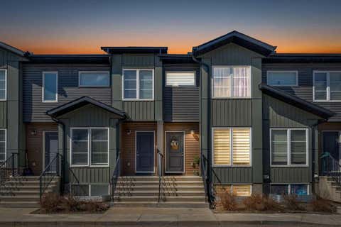 Photo of 31 Red Embers Parade NE #124, Calgary, AB T3N 1E9 (MLS # A2338103)