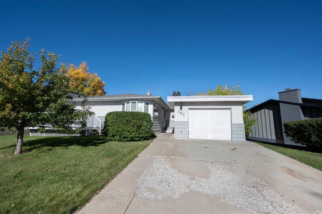 Photo of 107 Hallbrook Drive SW, Calgary, AB T2V 3H8 (MLS # A2346389)