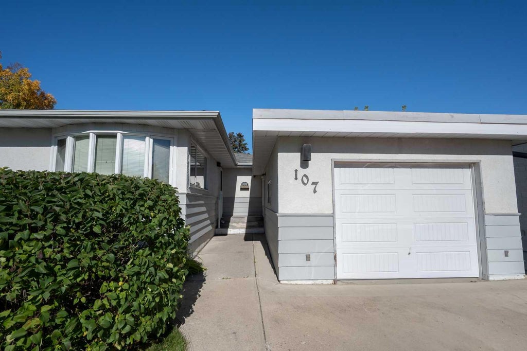 Photo of 107 Hallbrook Drive SW, Calgary, AB T2V 3H8 (MLS # A2346389)