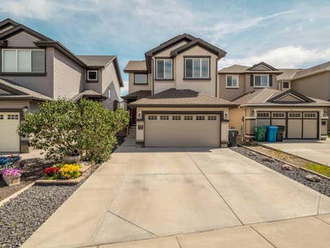 Photo of 386 Moonlight Way W, Lethbridge, AB T1J 5K1 (MLS # A2326925)