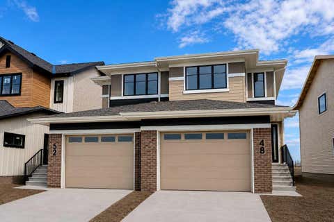 Photo of 52 Heritage Point, Cochrane, AB T4C 2J8 (MLS # A2322060)