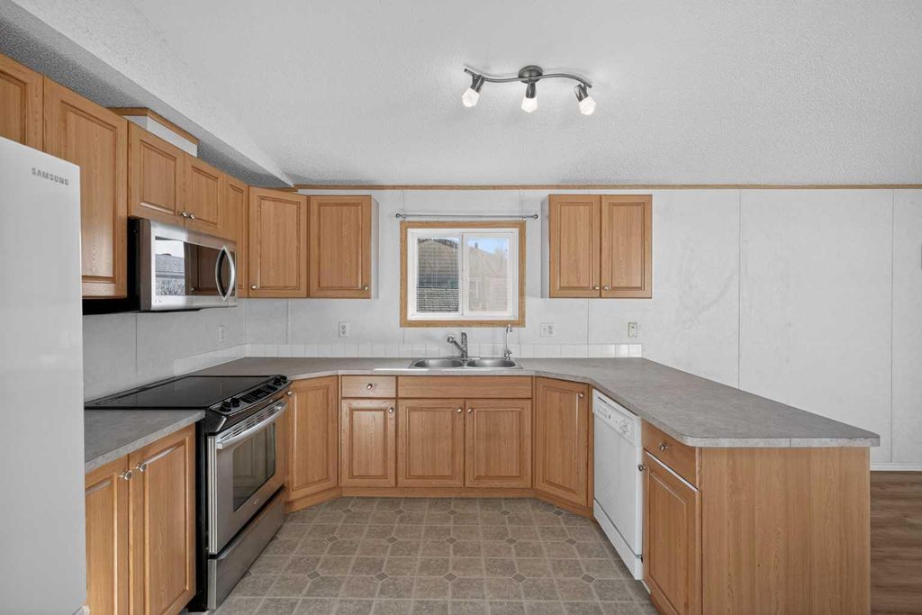 Photo of 125 Erin Woods Circle SE, Calgary, AB T2B 3E1 (MLS # A2299827)