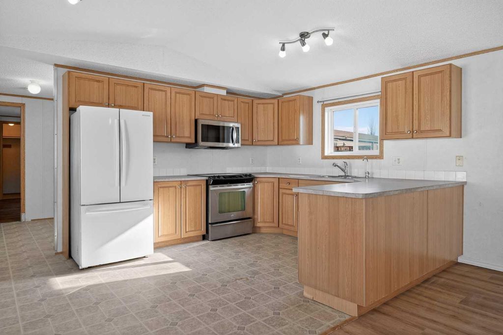 Photo of 125 Erin Woods Circle SE, Calgary, AB T2B 3E1 (MLS # A2299827)