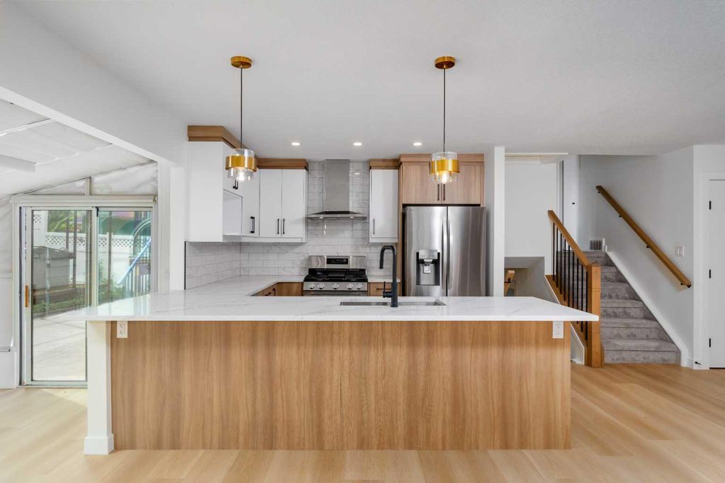 Photo of 312 Queensland Road SE, Calgary, AB T2J 3S6 (MLS # A2316310)