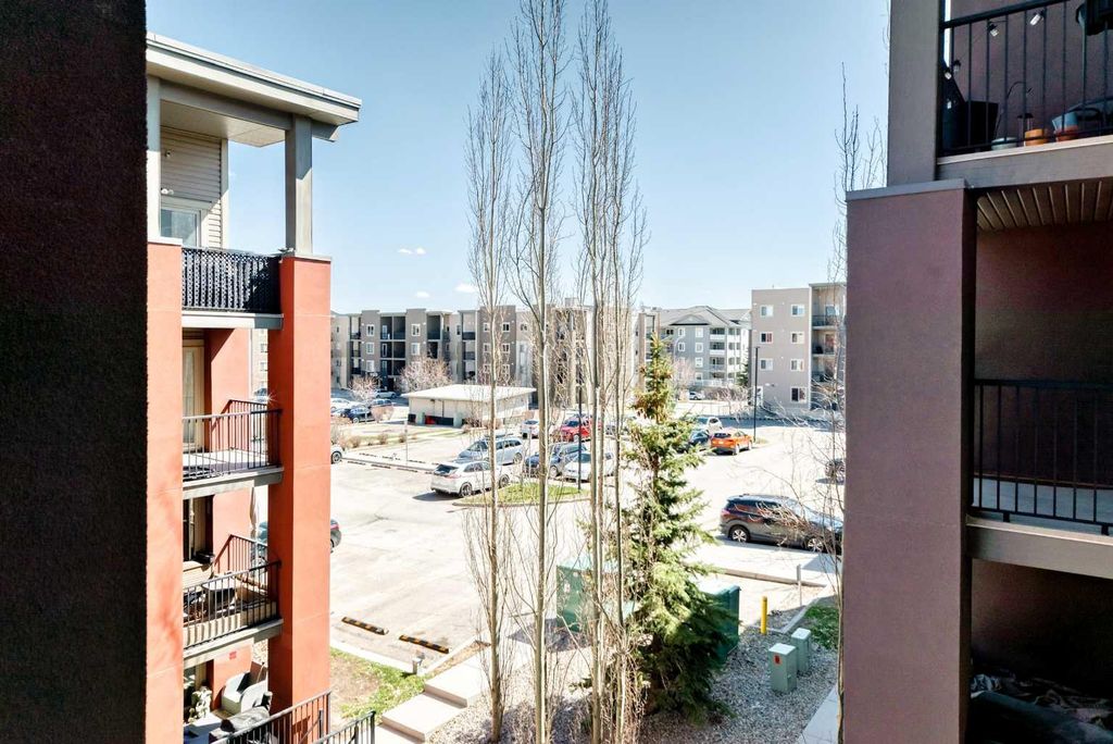 Photo of 403 Mackenzie Way SW #4304, Airdrie, AB T4B 3V7 (MLS # A2319208)