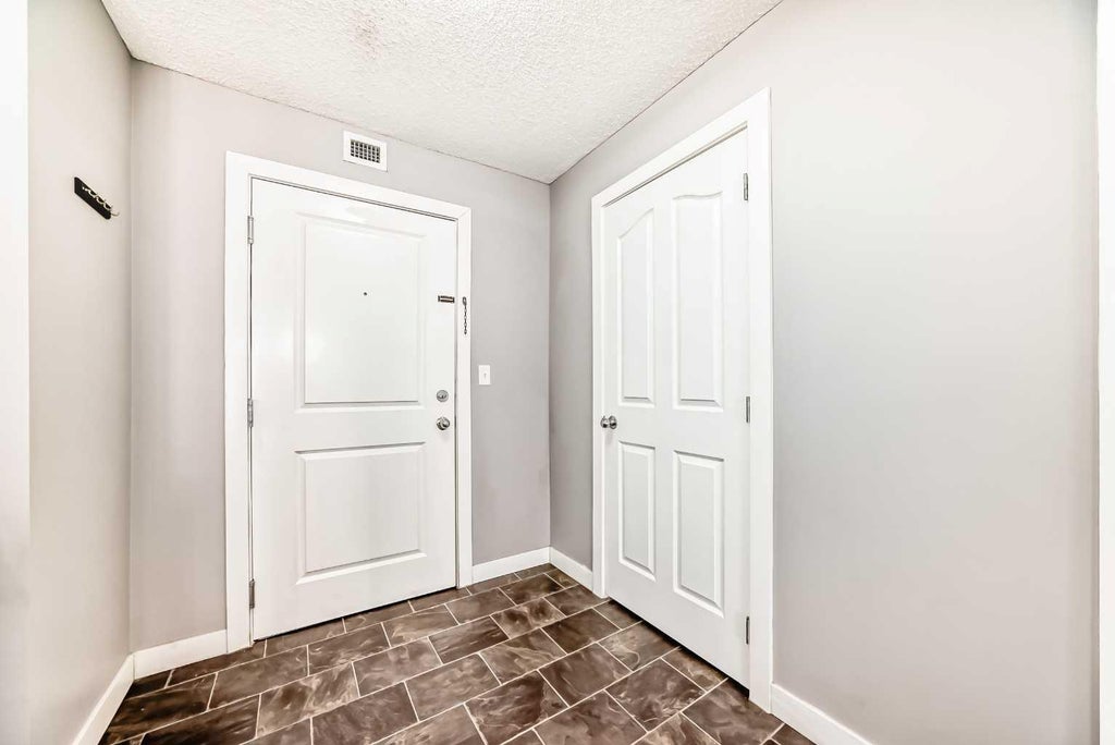 Photo of 403 Mackenzie Way SW #4304, Airdrie, AB T4B 3V7 (MLS # A2319208)
