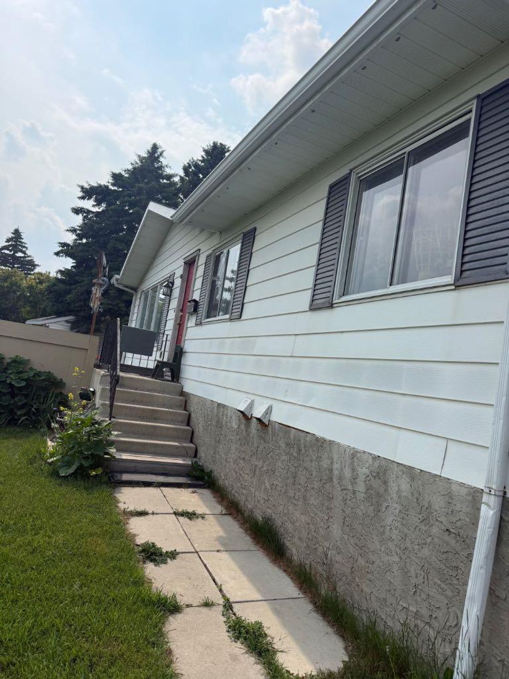 Photo of 112 Huntstrom Drive NE, Calgary, AB T2K 5T5 (MLS # A2325633)