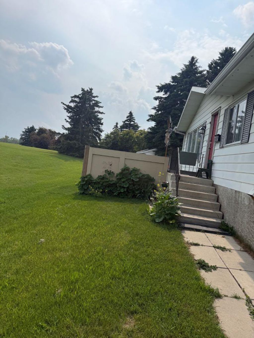 Photo of 112 Huntstrom Drive NE, Calgary, AB T2K 5T5 (MLS # A2325633)
