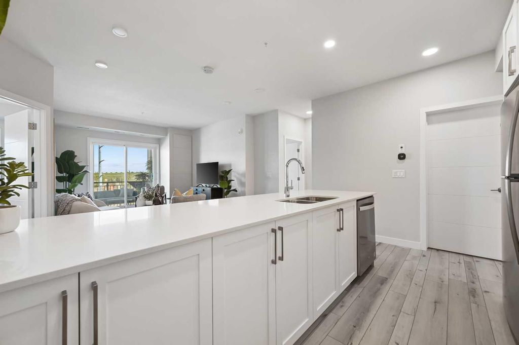 Photo of 255 Les Jardins Park SE #310, Calgary, AB T2C 5V3 (MLS # A2286104)
