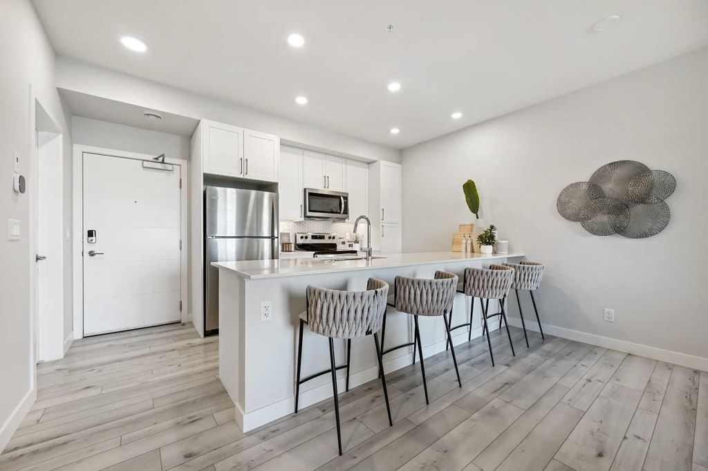 Photo of 255 Les Jardins Park SE #310, Calgary, AB T2C 5V3 (MLS # A2286104)
