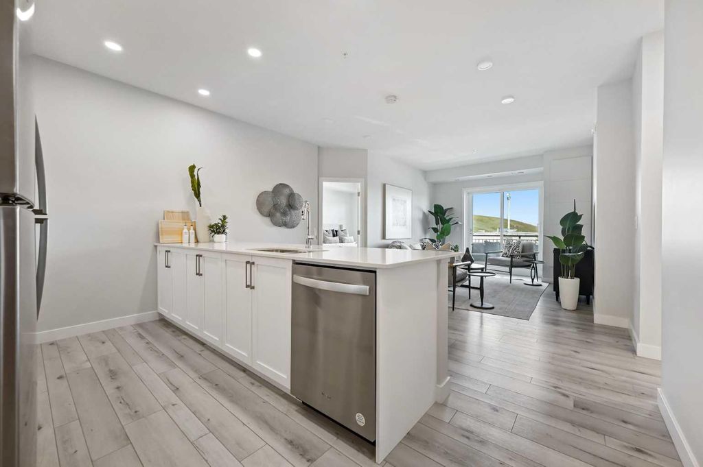 Photo of 255 Les Jardins Park SE #310, Calgary, AB T2C 5V3 (MLS # A2286104)