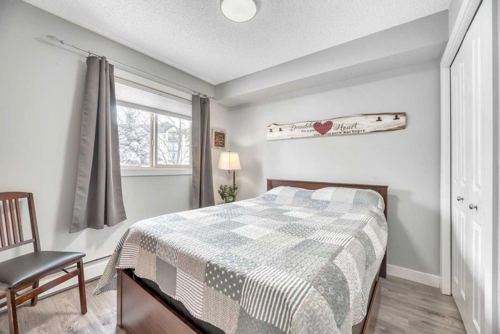 Photo of 403 Mackenzie Way SW #8109, Airdrie, AB T4B 3V7 (MLS # A2305835)