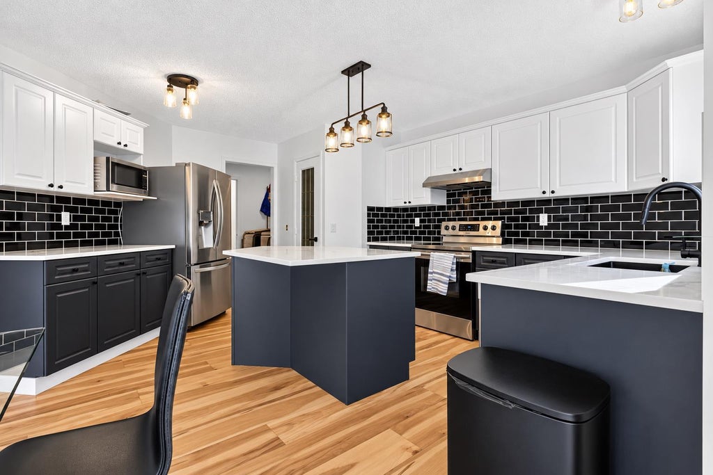 Photo of 45 Bow Ridge Drive, Cochrane, AB T4C 1V5 (MLS # A2353124)