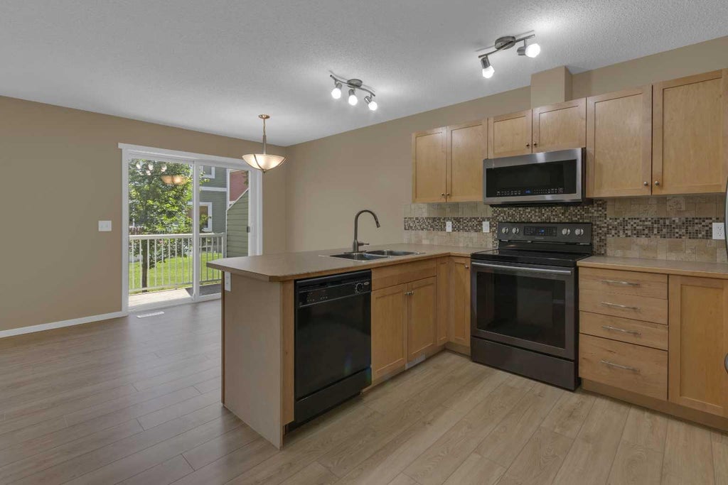 Photo of 800 Yankee Valley Boulevard SE #702, Airdrie, AB T4A 2L2 (MLS # A2327841)