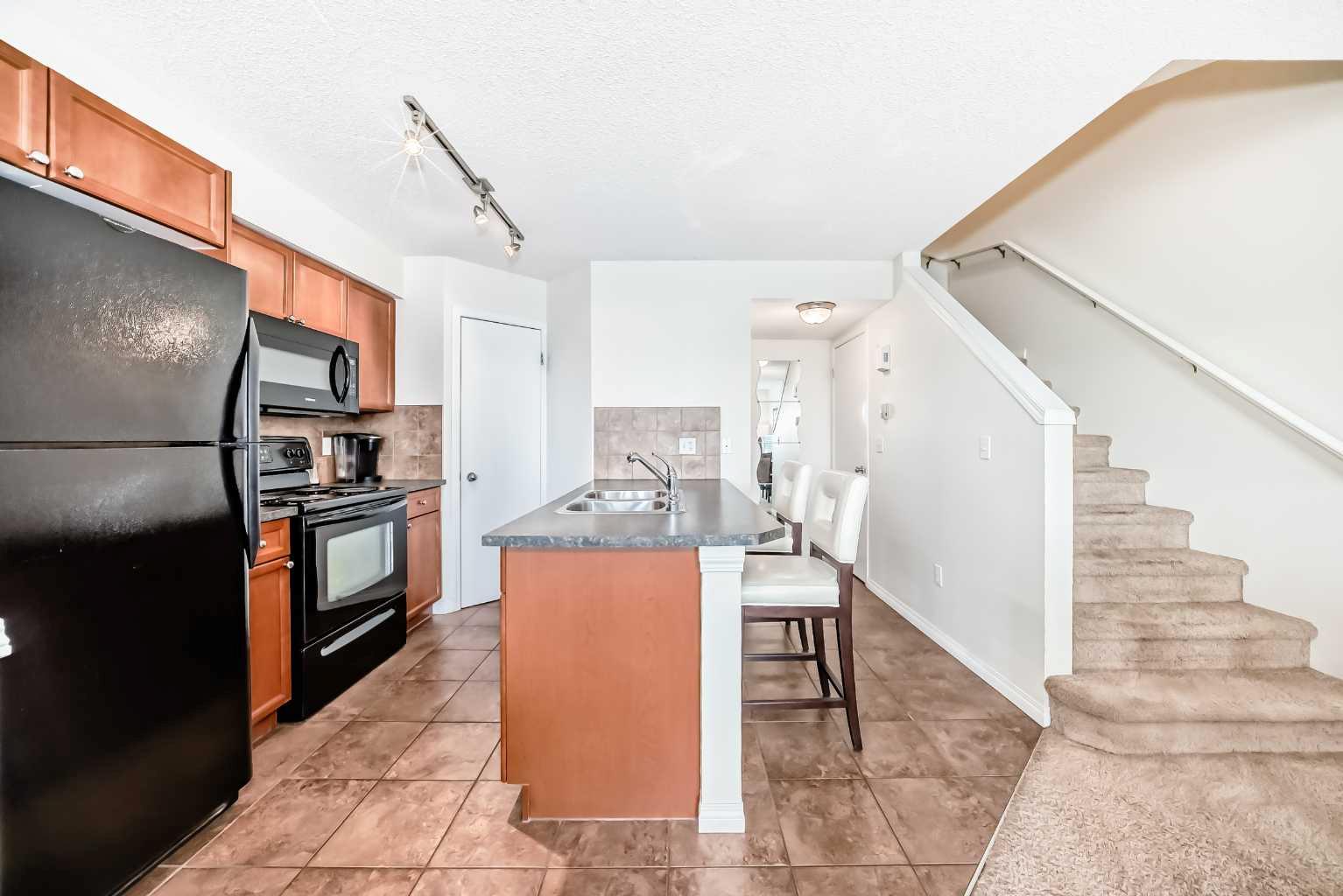 21 McKenzie Towne Gate SE #12