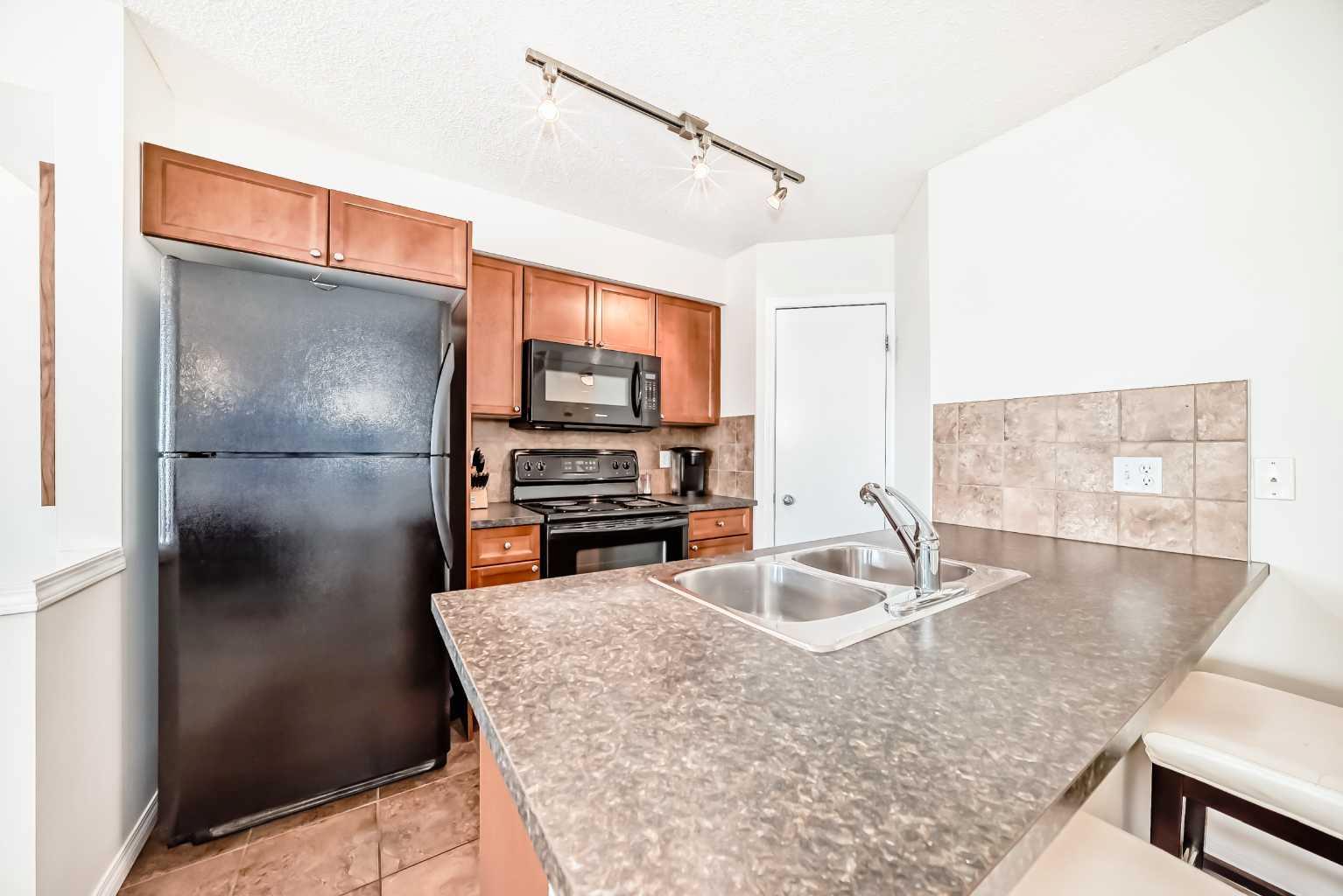 21 McKenzie Towne Gate SE #12