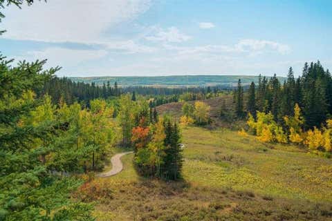 Photo of 56 Discovery Woods Villas SW, Calgary, AB T3H 5A7 (MLS # A2334494)