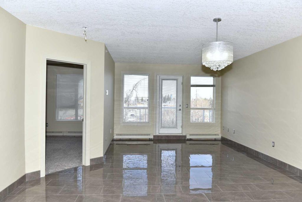 Photo of 3101 34 Avenue NW #411, Calgary, AB T2L 2A3 (MLS # A2304852)