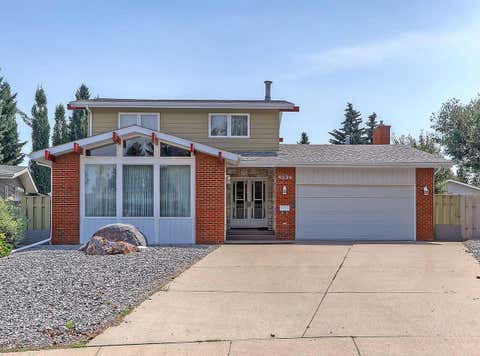 Photo of 9556 Oakland Way SW, Calgary, AB T2V 4G5 (MLS # A2337009)